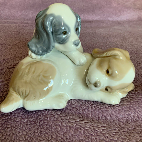 Nao lladro playing puppies - by,