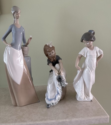Three nao lladro statues - three,