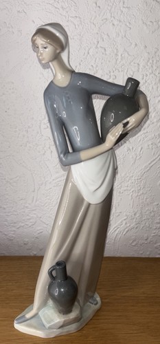 Lladro girl with jug - with,