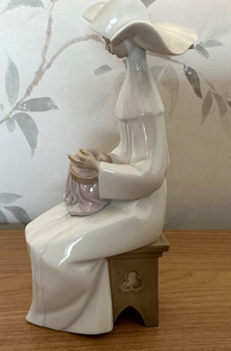 Retired lladro nun figurine - retired,