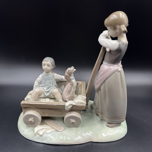 Lladro girl pulling boy and - pulling,
