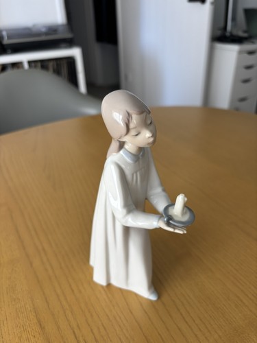 Damaged lladro girl - holding, a